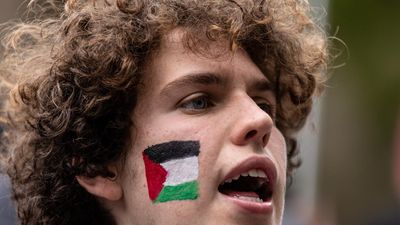 Pro-Palestine protesters rally at road cycling titles
