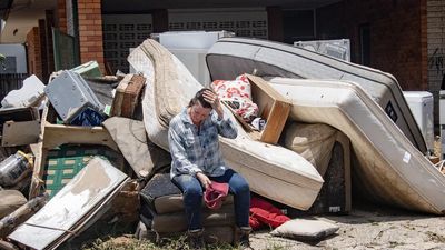 Storm clouds loom for economy as rain, floods take toll