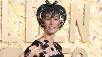 Rosamund Pike channels Saltburn at the Golden Globes - and her veil has got everyone talking