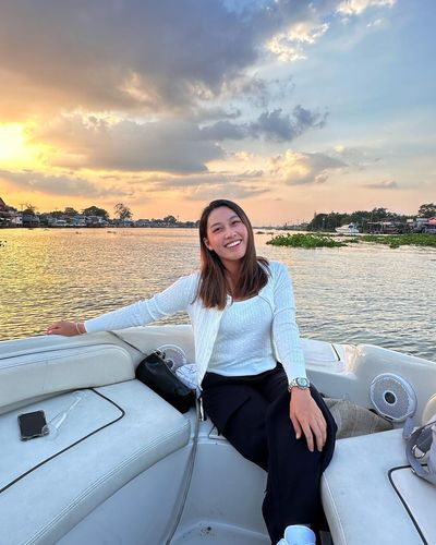 Embracing the Serenity: ATTHAYA THITIKUL's Tranquil Sunset Boat Pose