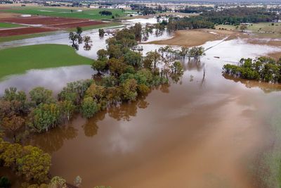 Hundreds evacuated and dozens rescued as devastating floods rip through Australian holiday hotspot