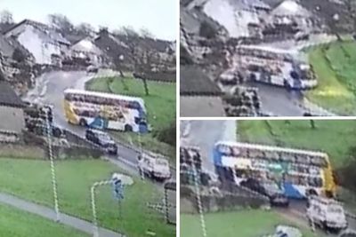 Double decker school bus skids on ice and smashes into parked cars