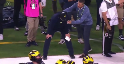 John Harbaugh delightfully surprised his brother Jim Harbaugh on the national title game sidelines