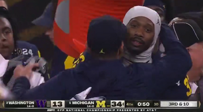 Jim Harbaugh successfully dodged the first Gatorade bath after Michigan won the national title