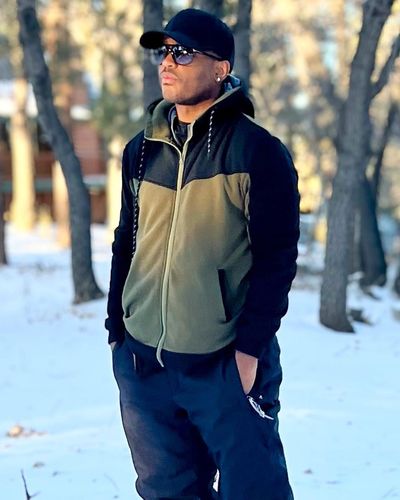 Larenz Tate Shines in Snowy Splendor with Charismatic Confidence