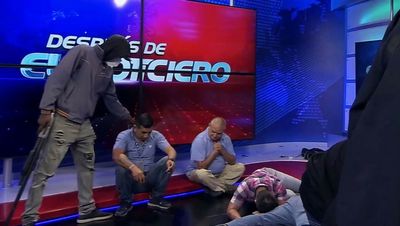 Ecuador on brink of civil war as masked gunmen storm TV studio and gangs threaten executions