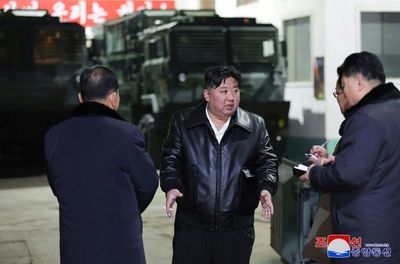 N. Korea's Kim Brands Seoul 'Principal Enemy' On Weapons Factory Tour