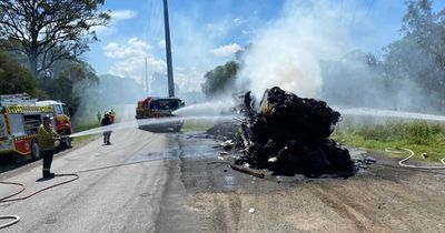 Watch as crews extinguish scrap cars in flames on Pacific Motorway