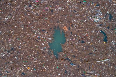 Tons of trash clogs a river in Bosnia. It's a seasonal problem that activists want an end to