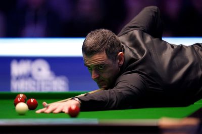 Ronnie O’Sullivan overcomes illness to grind past Barry Hawkins at Masters