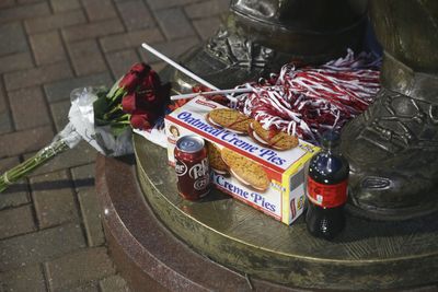 Alabama fans honored Nick Saban by placing Cokes and Little Debbie snacks by his statue