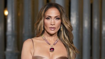 Jennifer Lopez Rocked A Little Black Dress To Celebrate This Is Me...Now, But Honestly How Does It Stay On?