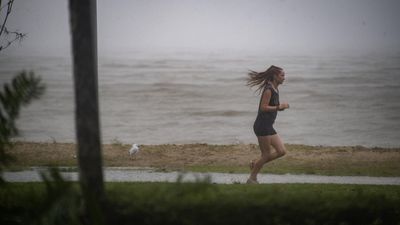 Desperate boat rescue as monsoon drenches north Qld