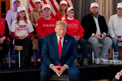 Trump's supporters stand for hours in the cold to see him in Iowa a day before the GOP caucuses