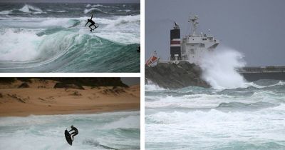 Surfers brave gnarly ocean as gloomy weather rolls in