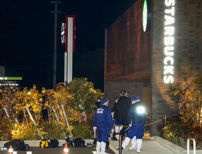 Police are searching for a suspect who shot a man to death at a Starbucks in southwestern Japan