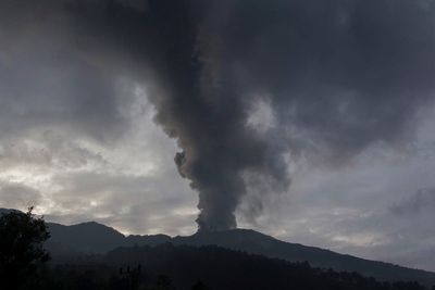 Indonesia evacuates about 6,500 people on the island of Flores after a volcano spews clouds of ash