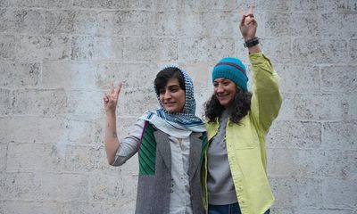 Iranian journalists celebrating release from jail charged for not wearing hijab