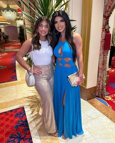 Teresa Giudice and Friend Radiate Elegance in Blue Dress Pose