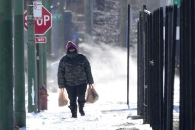 Arctic blast brings frigid temperatures and storm system approaches