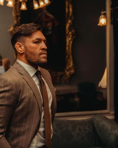 Conor McGregor Shines in Polished Brown Suit for Success