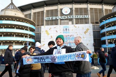The half-and-half scarf: the unacceptable yet unavoidable football match day accessory