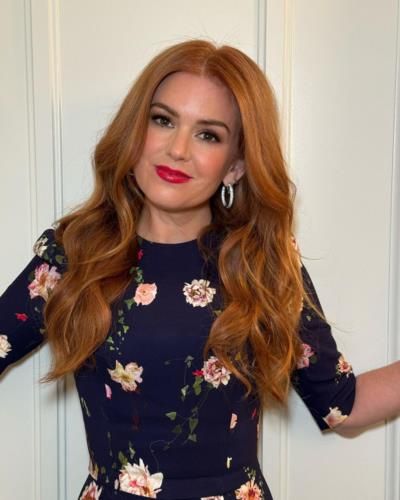Isla Fisher Shines in Vibrant Floral Dress and Graceful Poses