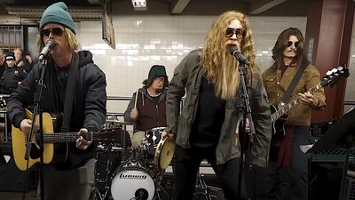 "We got a good crowd here!" Watch a heavily-disguised Green Day busk a hard rockin' cover of Bad Company's Feel Like Makin' Love on a New York subway platform