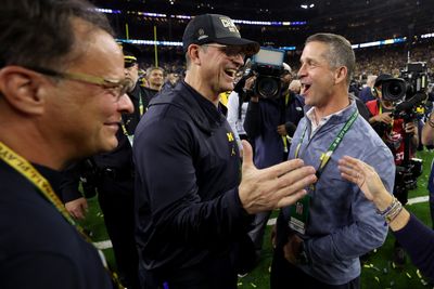 John Harbaugh greets brother Jim before Ravens face Texans