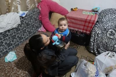 Radiant Joy: Captured Moments of Endi Demneri and a Baby