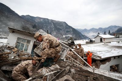 China races to find landslide survivors in subzero temperatures