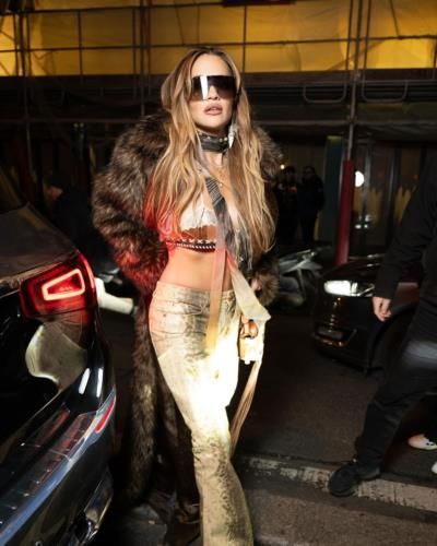 Rita Ora Shines in Dazzling Golden Outfit and Fur Coat