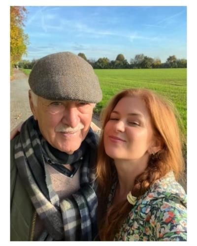 Isla Fisher Mourns Father's Loss: A Year of Heartache