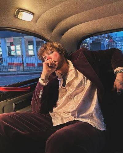 The Stylish Charisma of James Arthur: A Pose in Adventure