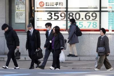 Asian shares lower on slowing inflation, upbeat US economy