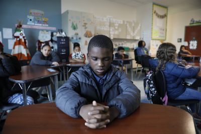 To help these school kids deal with trauma, mindfulness lessons over the loudspeaker