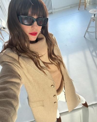 Nina Dobrev stuns in sophisticated beige ensemble and stylish coat