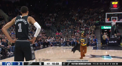 The Spurs mascot dressed up as Batman and chased a loose bat around the court during the Timberwolves game