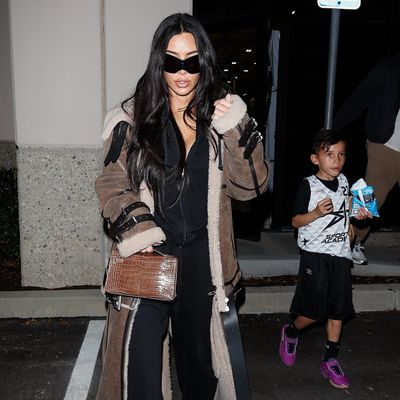 I Can't Get Over Kim Kardashian Wearing a Fur Coat and Hermès Kelly Bag to Her Son's Basketball Game