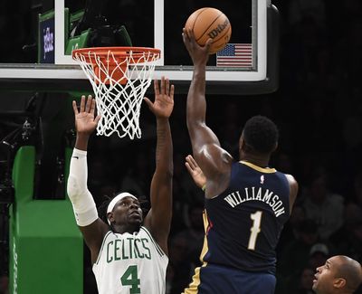 Holiday, Celtics erase shaky start, defeat Pelicans 118-112