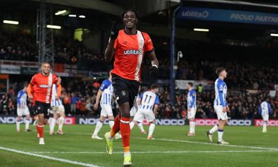 Luton climb out of drop zone after Adebayo hat-trick stuns Brighton