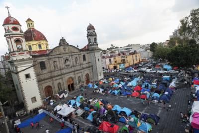 Police attacked near migrant shelter; community center closed for migrants