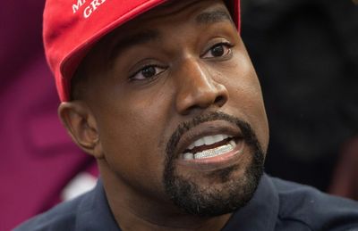 Kanye West Snatches Reporter's Phone In Heated Encounter