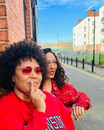 Emeli Sandé and Friend Rock Vibrant Coordinated Red Outfits