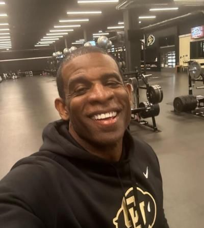 Deion Sanders: Gym Icon Sets Style Trends with Sleek Black Hoodie