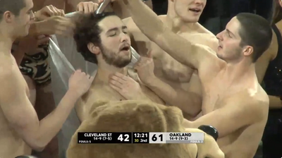 An Oakland basketball fan shaved his head to distract a Cleveland State player shooting free throws
