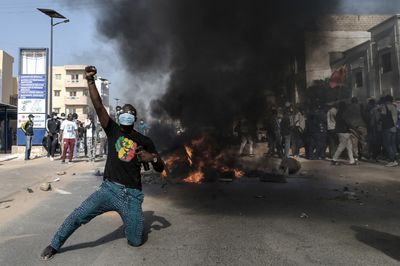Police and protesters clash after Senegal election postponed