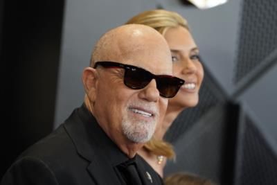 Billy Joel attends 2024 Grammys with wife and two daughters