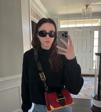 Chloé Lukasiak Radiates Cool Style in Black Shirt and Sunglasses