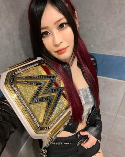 Glimpse of Victory: Iyo Sky Poses with WWE Championship